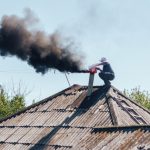 Chimney,Sweep,Cleaning,A,Chimney,Standing,Balanced,On,The,Apex