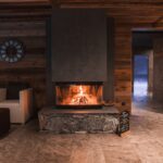 Warm,Room,With,Wooden,Walls,,Modern,Fireplace,,Armchairs,,And,Spa