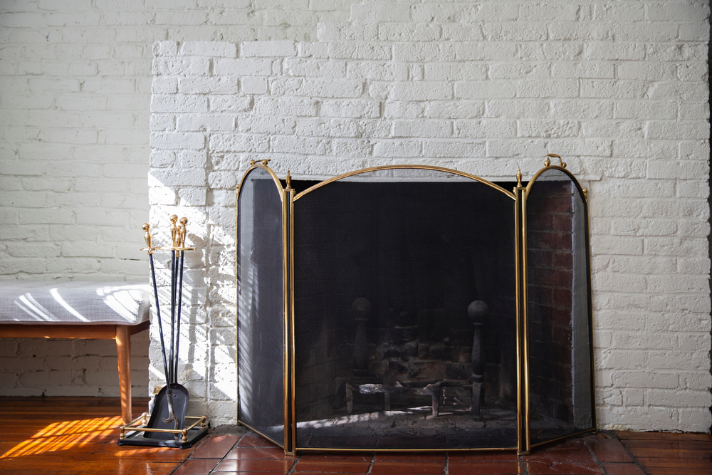 Fireplace,With,Black,Fire,Guard,Screen,And,Tools,Like,Shovel