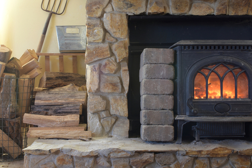 Mountain,Cottage,Heat,From,Wood,Stove,Installed,In,Front,Of