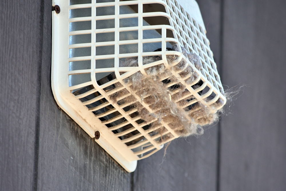 An,Outside,Dryer,Vent,Shown,With,Considerable,Lint,And,Debris